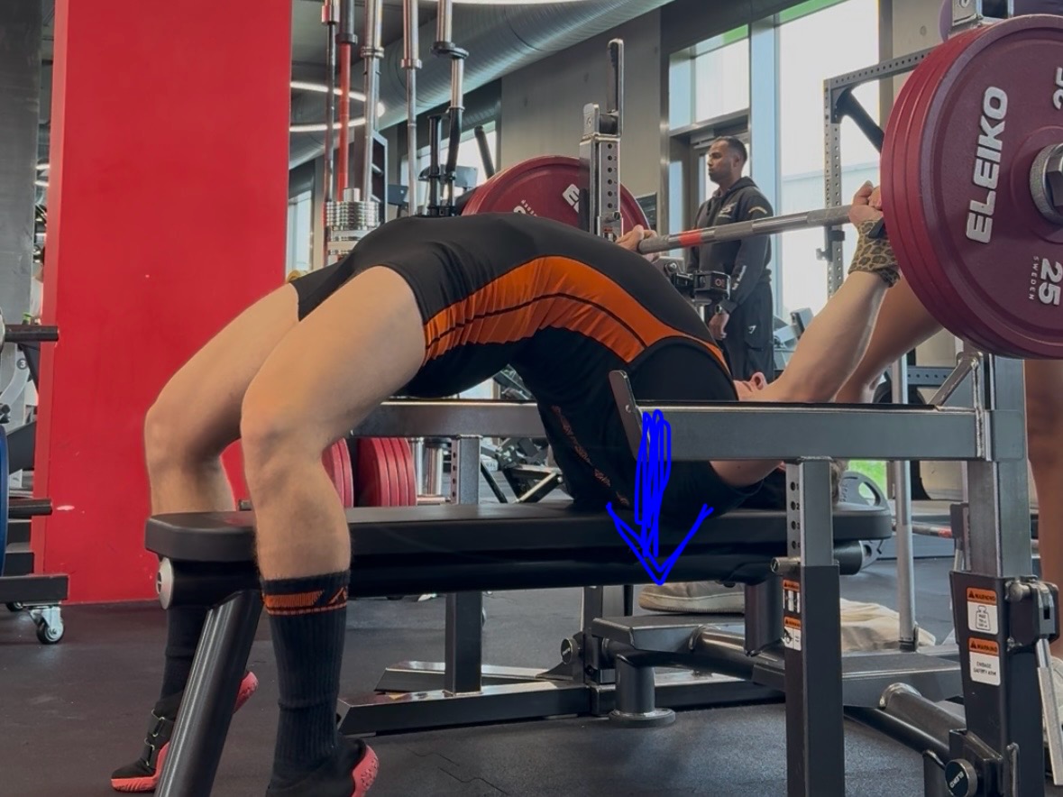 A photo showing how to pin your upper back into the bench